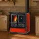 Cuisinière à bois Rosetta rouge et noire 7,9 kW avec four installée dans une cuisine rustique