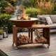 Brasero BBQ plancha Brasinox Fiesta Island Ø75 cm installé sur une terrasse avec rangement à bûcheso