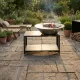 Brasero plancha extérieur Brasinox Fiesta 100 cm installé dans un jardin